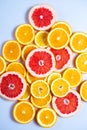 Slises of different citruses on the white background. Close-up of slised citruses.