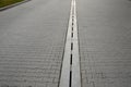 Slit gutters drain and remove dirt from traffic areas of highways, roads. Slit gutters drain and remove dirt from traffic areas o