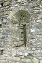 Slit window in stone. Royalty Free Stock Photo