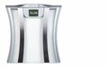 Sliver bathroom scale showing Slim on screen on white background. Health Concept