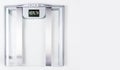 Sliver electric bathroom scale on white background. Health and weight loss Concept. Copy Space