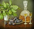 Slivovitz bottle and plums Royalty Free Stock Photo