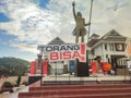 the slogan and logo of the XX Papua PON 2021 installed against the background of the ANIM-HA statue