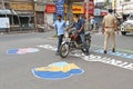 Slogans are painted on the road as part of a campaign to get people to comply with the lockdown to prevent coronavirus.