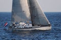 Sloop sailboat USA 18 sailing in open waters. Royalty Free Stock Photo