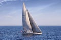 Sloop sailboat USA 18 sailing in open waters. Royalty Free Stock Photo