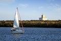 Sloop sailboat on a quiet sea in open waters. Royalty Free Stock Photo