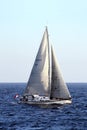 Sloop sailboat USA 18 sailing in open waters. Royalty Free Stock Photo