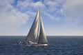 Sloop sailboat USA 18 sailing in open waters. Royalty Free Stock Photo