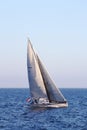 Sloop sailboat USA 18 sailing in open waters. Royalty Free Stock Photo