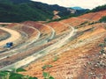 Slope cutting with berm drains