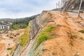 Slope and earth retention wall along hilly terrain