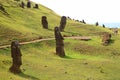 The slope full of abandoned giant Moai statues of Rano Raraku volcano with Pacific ocean in backdro