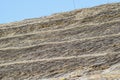 The slope of the roof of reeds and straw