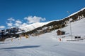 Slope and yellow gondolas with chalet in ski resort Serfaus Fiss Royalty Free Stock Photo