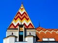 sloped enamel coated clay tile roof with colorful yellow, red, blue and white geometric pattern Royalty Free Stock Photo