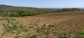 The slopes of the mountains with agricultural fields. Freshly plowed soil. Land cultivation and agricultural work. Fruska Gora, Royalty Free Stock Photo