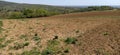 The slopes of the mountains with agricultural fields. Freshly plowed soil. Land cultivation and agricultural work. Fruska Gora, Royalty Free Stock Photo