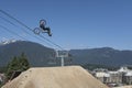 A slopestyle rider practices for the Crankworx Whistler 2022 finals