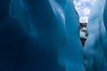 Sloping narrow entrance to ice cave on the Matanuska Glacier in Alaska Royalty Free Stock Photo