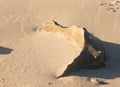 Sloping sand with rock formation at Australian beach Royalty Free Stock Photo