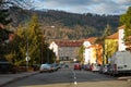 A sloping street in the Moravian town of Blansko. View of residential buildings and background with wooded hills. Royalty Free Stock Photo