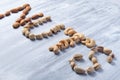 The sloping word nuts is made up of almonds, hazelnuts, cashews and pistachios Royalty Free Stock Photo