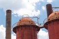 Sloss Furnaces National Historic Landmark, Birmingham Alabama USA, domed furnaces and smokestacks seen against a blue sky with clo