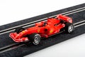 Slot car racing track with red formula one car Royalty Free Stock Photo