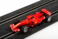 Slot car racing track with red formula one car Royalty Free Stock Photo
