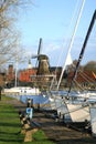 Sloten with windmill and sailboat. Netherlands. Royalty Free Stock Photo