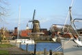 Sloten with windmill and sailboat. Netherlands. Royalty Free Stock Photo