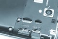 Slots for two SIM cards in a smartphone with an open back cover. Empty SIM slots. Blue tint. Selective focus Royalty Free Stock Photo