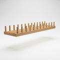 Slotted wooden rack for fabric bolts floating in mid air horizontally, on solid white background Royalty Free Stock Photo