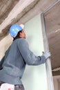 Slotting plasterboard into place Royalty Free Stock Photo