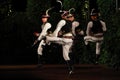 Slovak male dancers performing traditional dance night scene Royalty Free Stock Photo