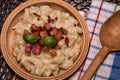 Slovak traditional dishes potato gnocchi with sheep`s cheese, on a wooden table laid on the table Royalty Free Stock Photo