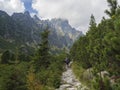 Slovakia, High Tatra mountain, September 13, 2018: Young men tourist hiking at the beautiful nature trail at high tatra mountains