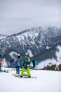 Slovakia, Jasna - February 4, 2022: winter mountains view ski resort slopes people skiing and snowboarding Royalty Free Stock Photo