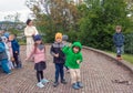 A group of schoolchildren with teachers on an excursion in Nitrograd