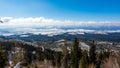 Slovakia: View of small tatra nizke tatry from the Strbske Pleso. Mountains panorama in far, trees in foreground. Beautiful far Royalty Free Stock Photo