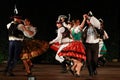 Slovakian dancers performing traditional dance in pairs