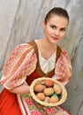 Slovakian girl holding painted easter eggs