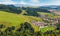 Slovakian town on grassy hillside in summer