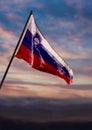 Slovenia flag, Slovenian flag waving on sky at dusk Royalty Free Stock Photo