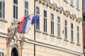 Flags of the European Union and Slovenia waiving together in the Slovenian capital city, Ljubljana.