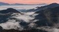 Slovenia, Somewhere Near Famous Place Jamnik. Magical Morning Misty Gradients. Fog Seeping Through The Trees And Hills.Foggy Mount