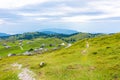 Slovenia velika planina big plateau, agriculture pasture land near city Kamnik in Slovenian Alps. Wooden houses on green land