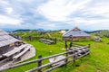 Slovenia velika planina big plateau, agriculture pasture land near city Kamnik in Slovenian Alps. Wooden houses on green land