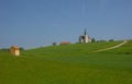 Slovenian countryside in spring with charming little church on a hill, in Slovenia Royalty Free Stock Photo